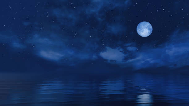 istock Full moon in starry night sky above ocean surface 1210429750