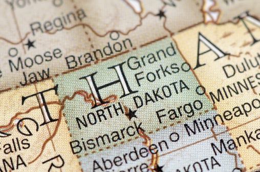 A close-up/macro photograph of North Dakota from a desktop globe. Adobe RGB color profile.