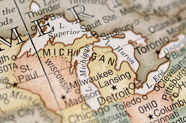 Close-up of American map focusing on Michigan A close-up/macro photograph of Michigan and the Great Lakes from a desktop globe. Adobe RGB color profile. great lakes stock pictures, royalty-free photos & images