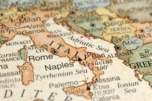 A close-up/macro photograph of Italy from a desktop globe. Adobe RGB color profile.