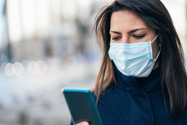 istock Woman with face protective mask 1210433255