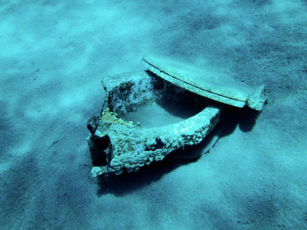 istock Old broken toilet under water at the bottom 1210437380