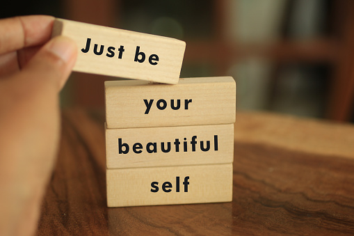 Inspirational quote on wooden blocks with text - Just be your beautiful self. Self love and confident concept in vintage style.