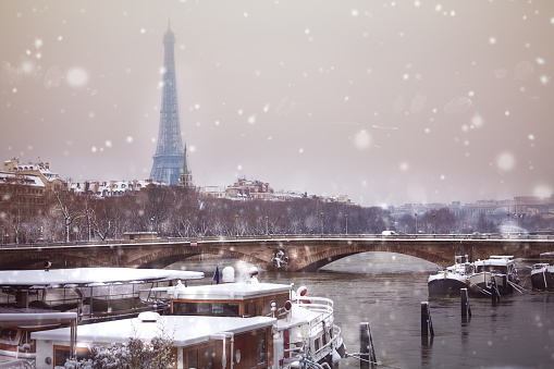 Eifel tower and bridge de l'Alma under snow, Paris after heavy blizzard