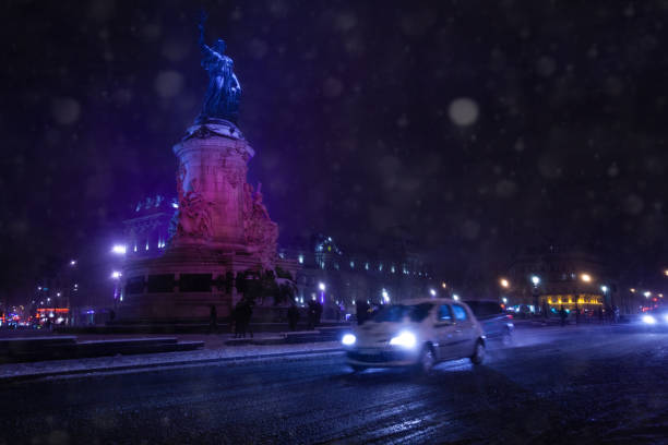 istock Place de la Republique and car on road under snow 1210442142