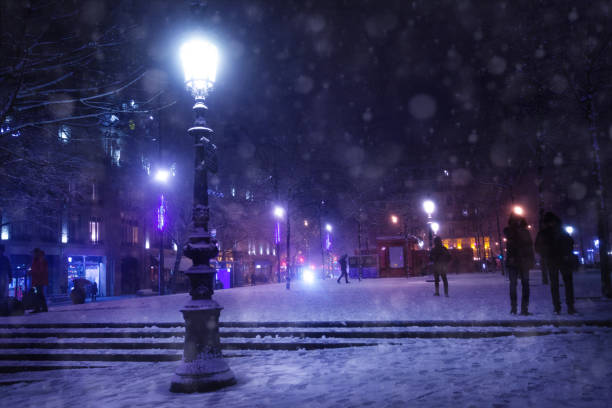 istock Street lamp on Republique square, Paris under snow 1210442149