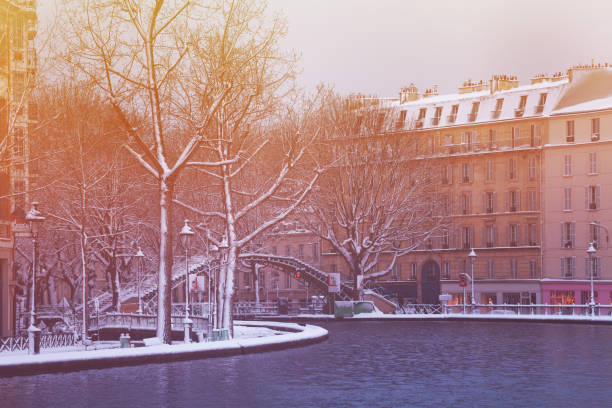 istock Bridge on Canal Saint Martin in Paris under snow 1210442172