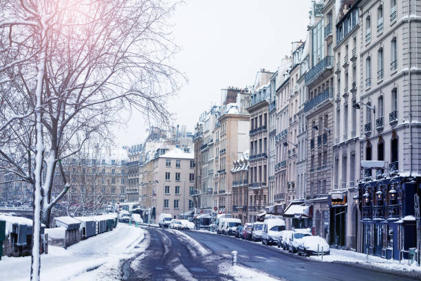 Snowy Paris streets near canal Saint Martin on winter day
