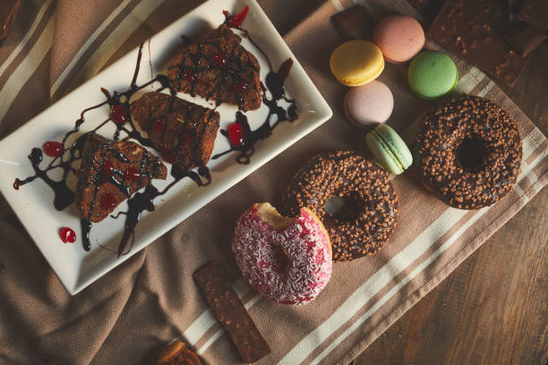 istock Directly Above Shot Of donuts, cocoa cake and coffee 1210446502