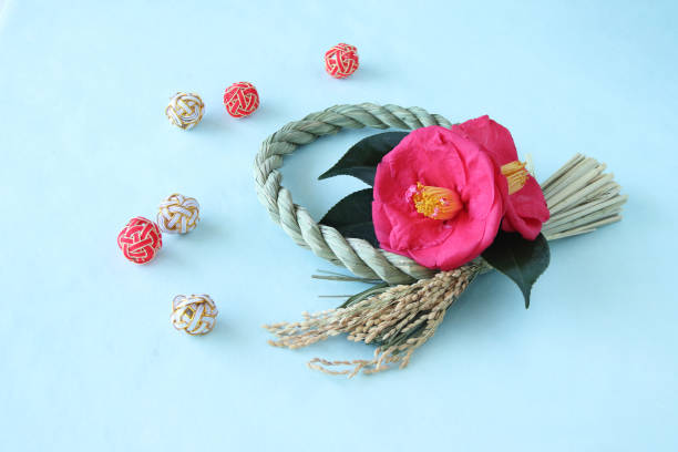 istock camellia and mizuhiki wreath 1210448242