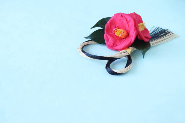 istock camellia and mizuhiki wreath 1210448411