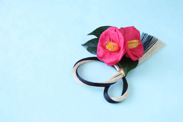 istock camellia and mizuhiki wreath 1210448465