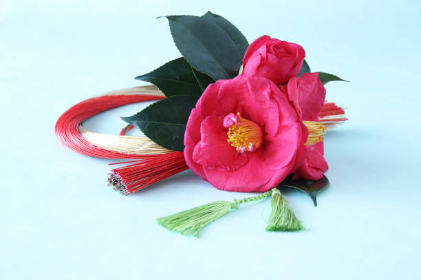 istock camellia and mizuhiki wreath 1210448536