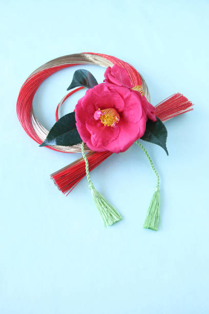 istock camellia and mizuhiki wreath 1210449240