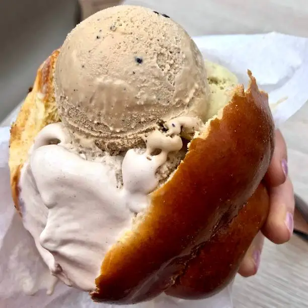 Brioche con gelato is a Typical breakfast in Sicily. Ice cream melts into the bread, turning into a delicious sweet sauce.