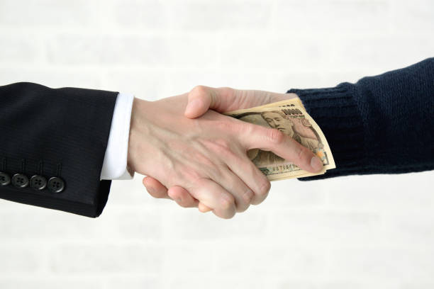 istock Business man receiving bribe 1210453432