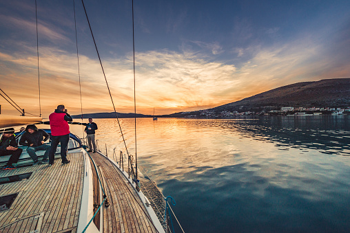 Yachting adventure friends on the sailing boat