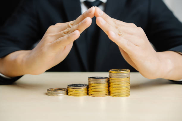 istock Businessman working with coin money currency. 1210454522