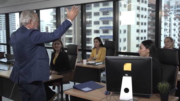 istock Senior leader giving advice speech to team members 1210455465
