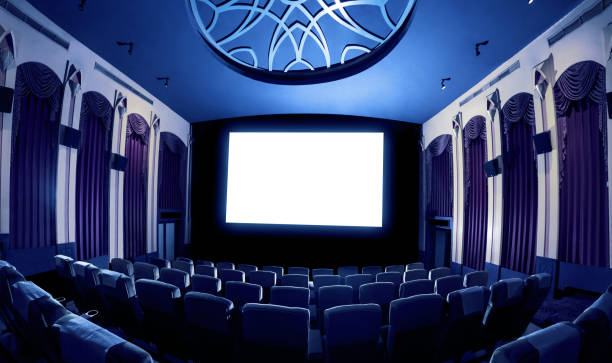 istock Cinema theater showing empty white movie screen. 1210456413