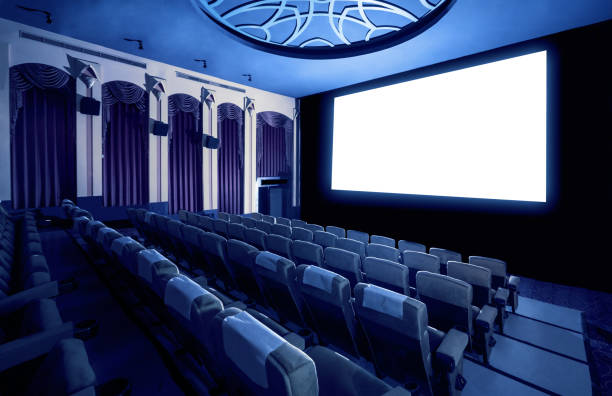 istock Cinema theater showing empty white movie screen. 1210456417