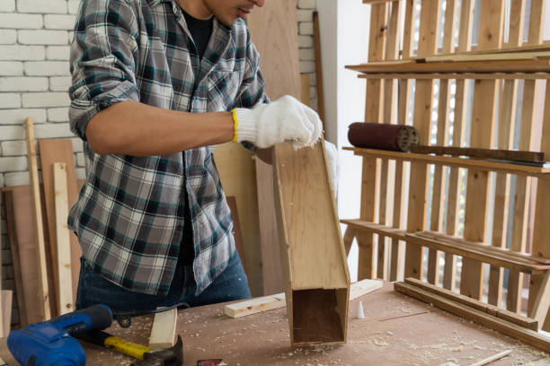 istock Carpenter working on wood craft at workshopCarpenter working on wood craft at workshop 1210457733