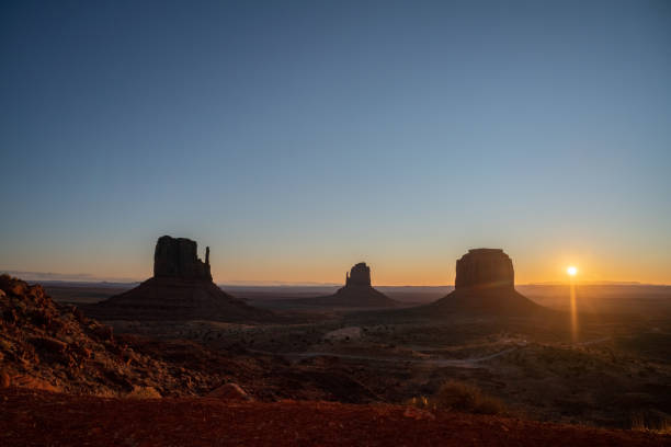 istock Monument Valley Skyline At Sunrise With The Mittens And North Window Monuments 1210459001
