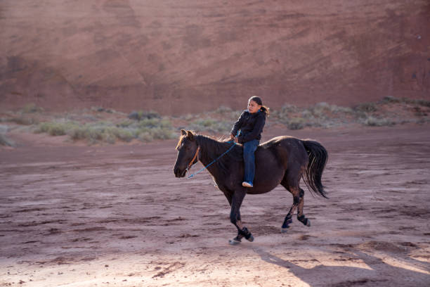 istock A Young Native American Boy, Riding His Horse 1210459615