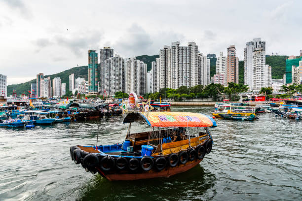 Traditional fishing trawler in the Aberdeen Bay in Hong Kong Island Hong Kong - July 27, 2019: Traditional fishing trawler in the Aberdeen Bay. Famous floating village in Aberdeen is an area and town on the south shore of Hong Kong Island aberdeen hong kong photos stock pictures, royalty-free photos & images