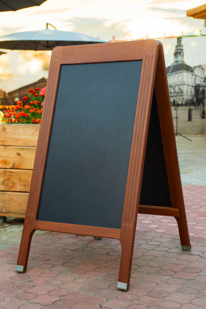 istock Empty restaurant menu blackboard on the street, menu chalkboard mockup, menu board template 1210463467