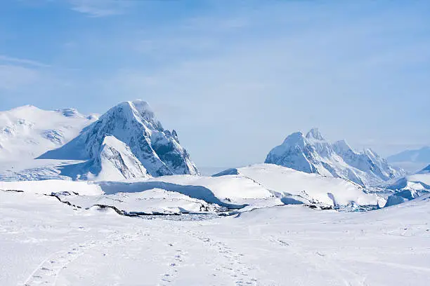 Photo of Mountain range in Antarctica covered in snow