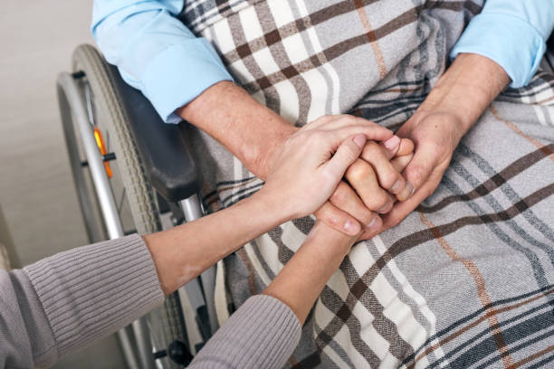 istock Holding hands of senior man 1210473911