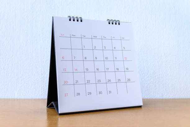 istock Generic Calendar With Days on wood table 1210475693