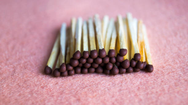 istock A bunch of matches on a beige background. 1210475848
