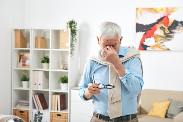 istock Tired senior man at home 1210476564
