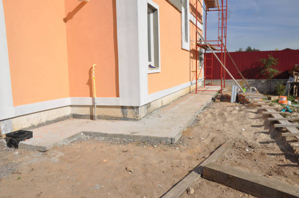 istock New house construction foundation waterproofing, damp proofing, insulation with concrete path to avoid water leaks for home wall. 1210477643