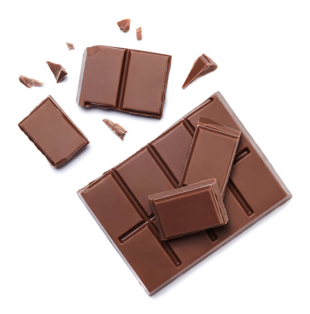Chocolate pieces Chocolate pieces isolated on white background. chocolate stock pictures, royalty-free photos & images