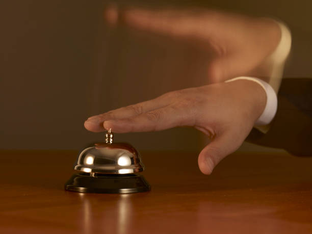 istock Blurred Motion Man Pushing Desk Service Bell 1210479457