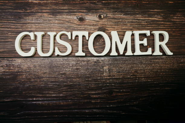 istock Customer alphabet letter on wooden background 1210485308