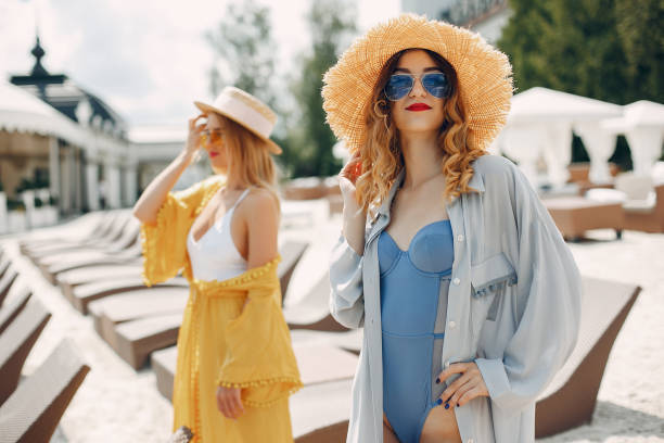 istock Two elegant girls on a resort 1210485388