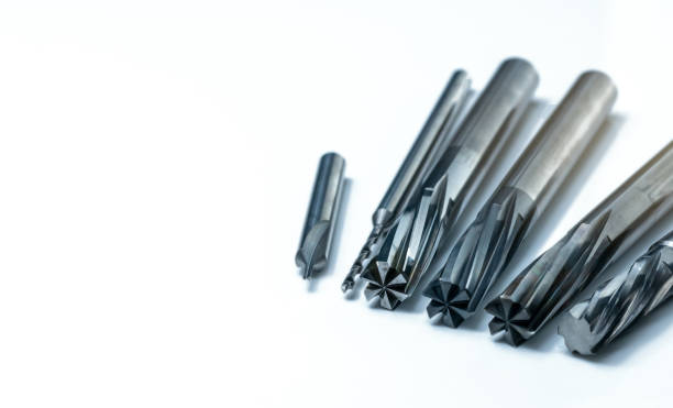 istock Special tools isolated on white background. Made to order special tools. Coated step drill, reamer, and endmill detail. HSS cemented carbide. Carbide cutting tool for industrial applications. 1210485668
