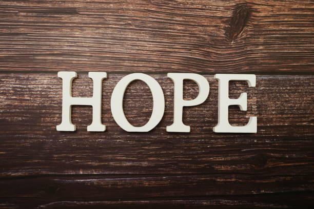 istock Hope alphabet letter on wooden background 1210485830