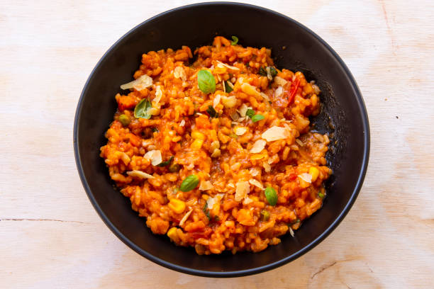 istock Risotto with tomatoes, fresh herbs and parmesan cheese 1210487034