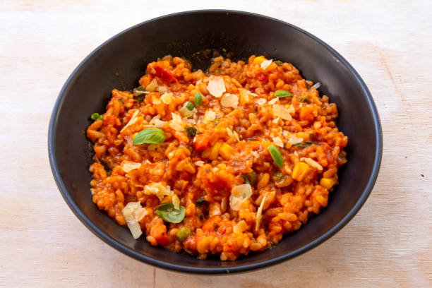 istock Risotto with tomatoes, fresh herbs and parmesan cheese 1210487717