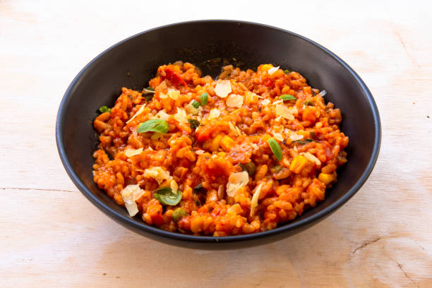 istock Risotto with tomatoes, fresh herbs and parmesan cheese 1210487925