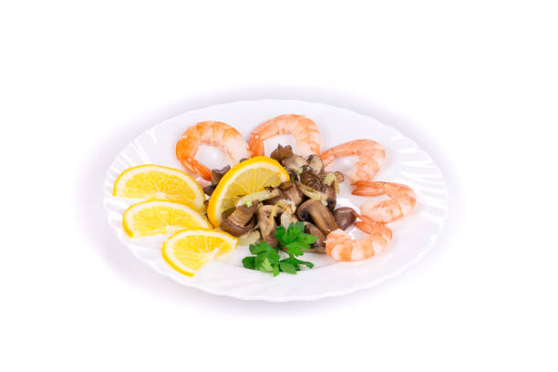 Shrimp salad with mushrooms. Isolated in a white background. Close-up.