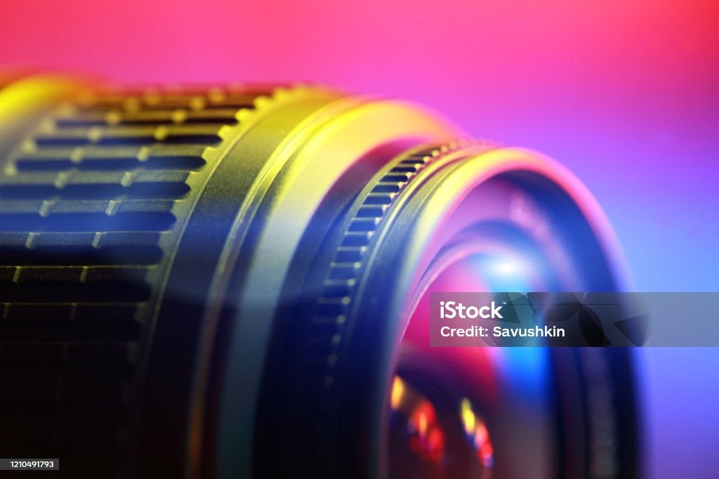 Lens, close-up Lens, close-up. Abstract color illuminated. Photograph Stock Photo