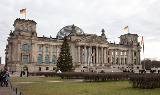 Berlin, Germany - December 30, 2019: People The Reichstag, German Parliament, on a cold day in december 30, 2019.