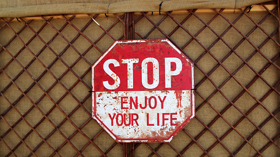 Funny signboard on the wall of a café close up view