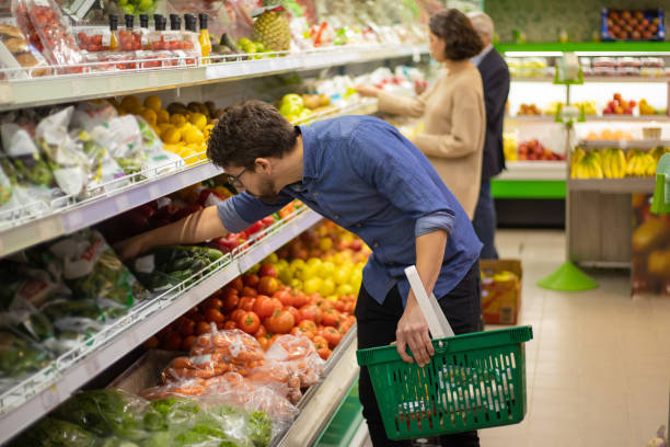 istock Focused people shopping in grocery store 1210494101